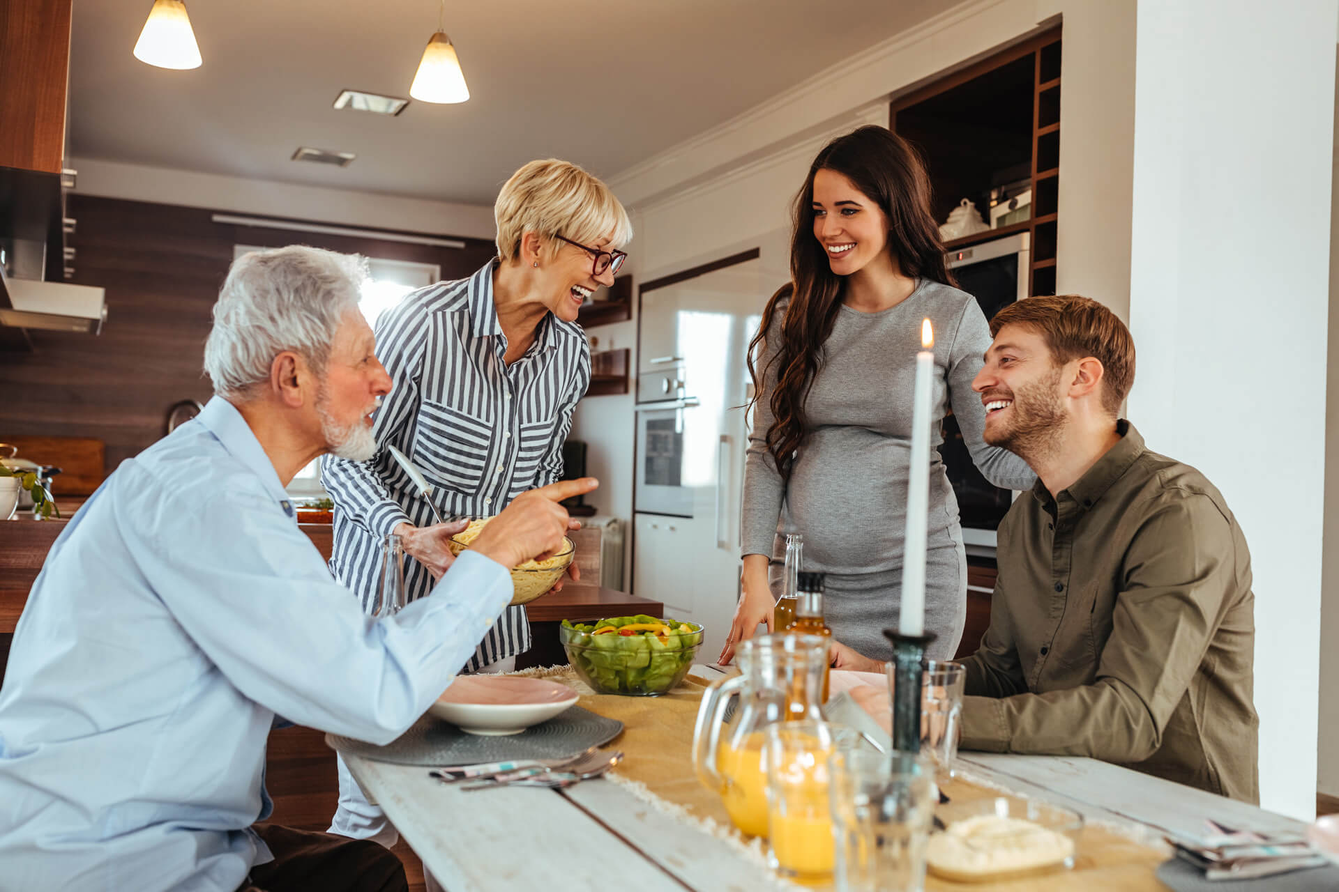 Joyful family enjoying an indoor meal